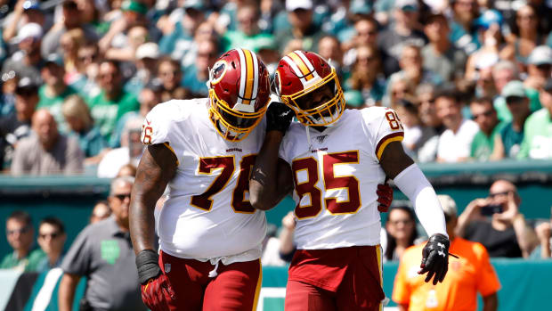 Morgan Moses, Vernon Davis (AP Photo/Matt Rourke)